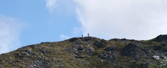 two people on the top of a ridgeline of Sheep Mountain