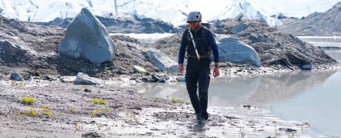 glacier guide near meltwater and glacial moraine
