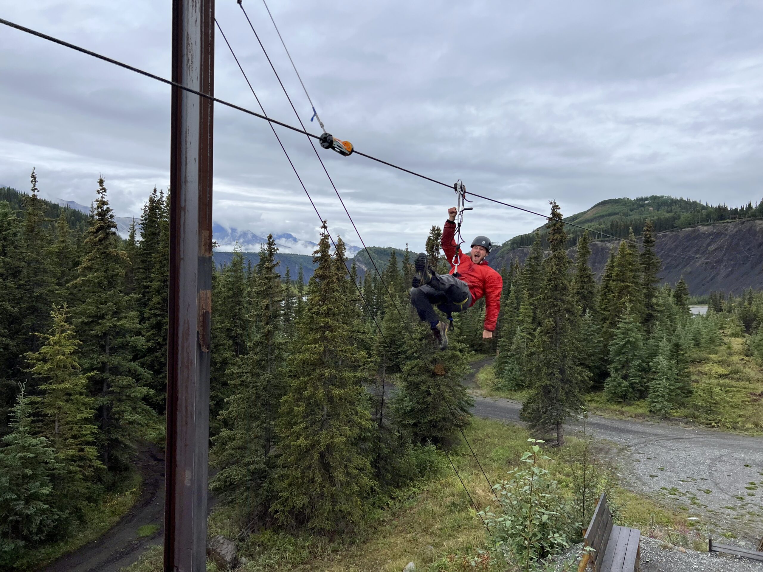 person ziplining down the G2 zipline