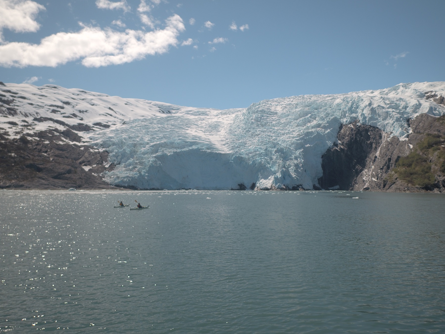 kayakers in front of tidal glacier