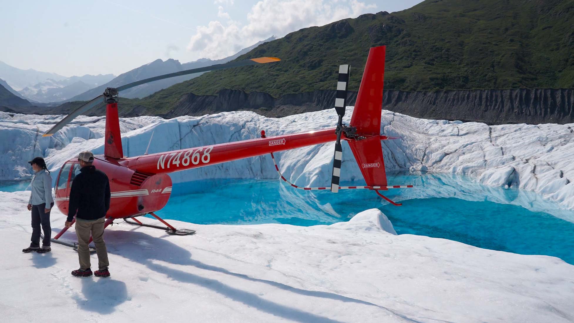 red helicopter on glacier ice