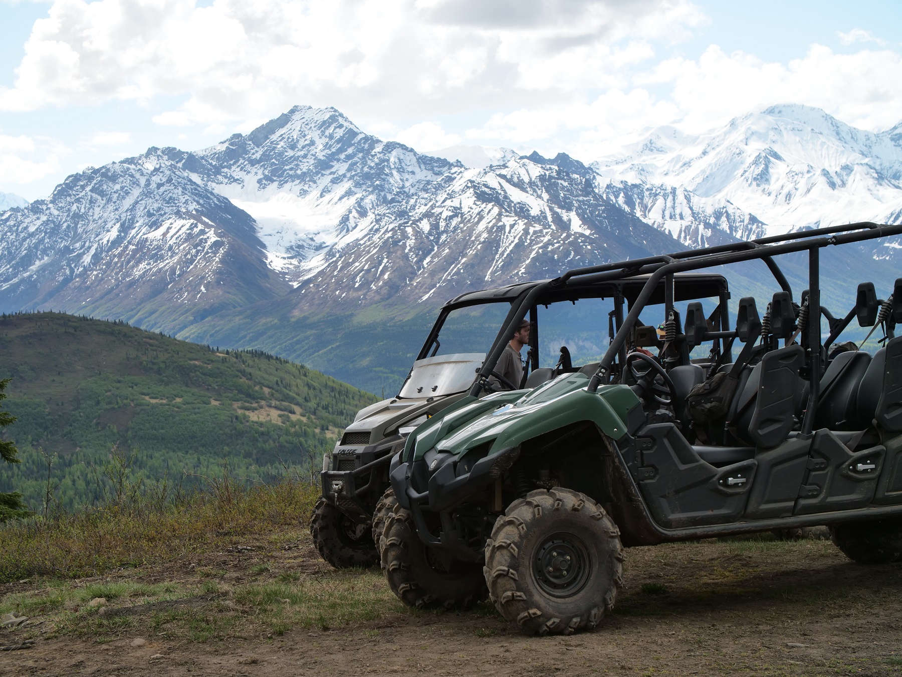 a truck with a mountain in the background