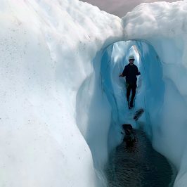 a person that is standing in the snow
