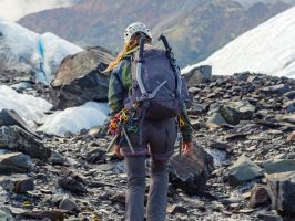 a man standing on a rocky hill