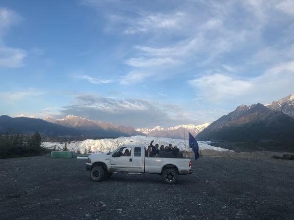Alaska Community a truck with a mountain in the background