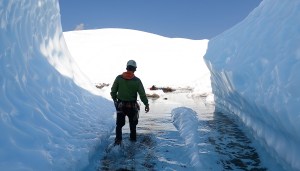 a man standing on top of a snow covered mountain