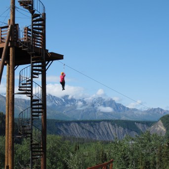a tower with a mountain in the background