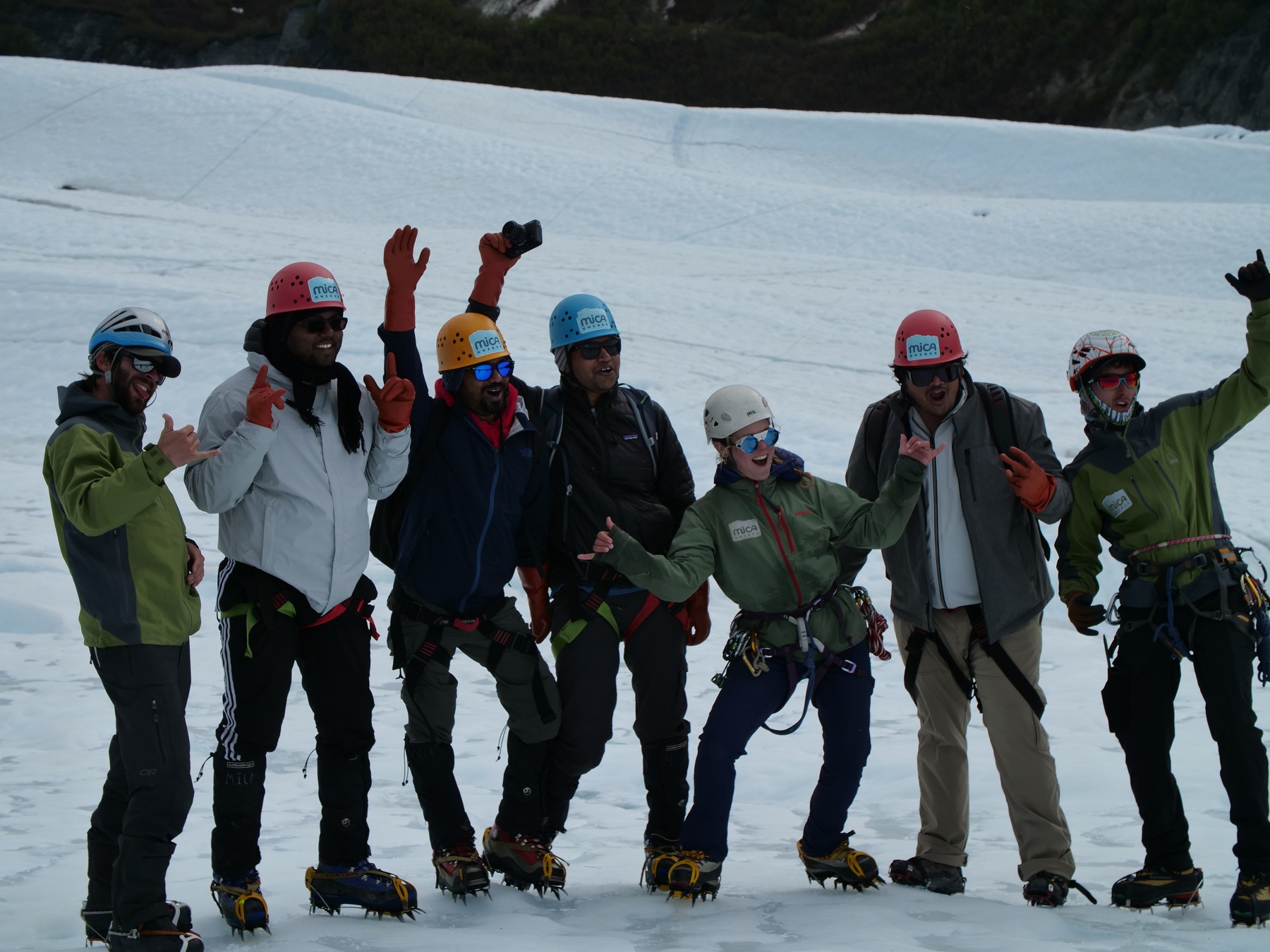 a group of ice climbers posing for a photo