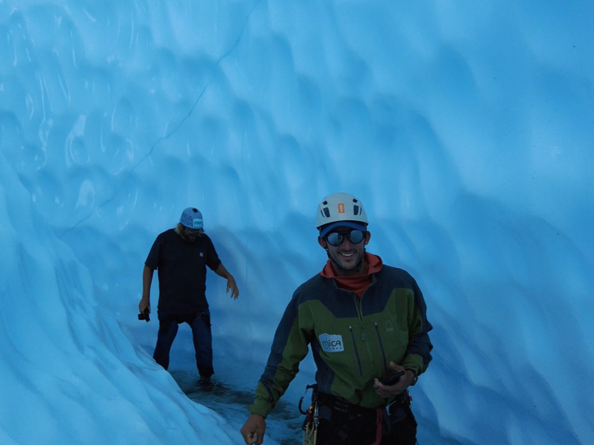 a man standing on a snow board