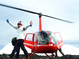 a person standing next to a helicopter
