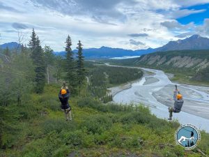 a group of people riding skis on top of a mountain