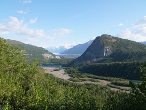 a body of water with a mountain in the background