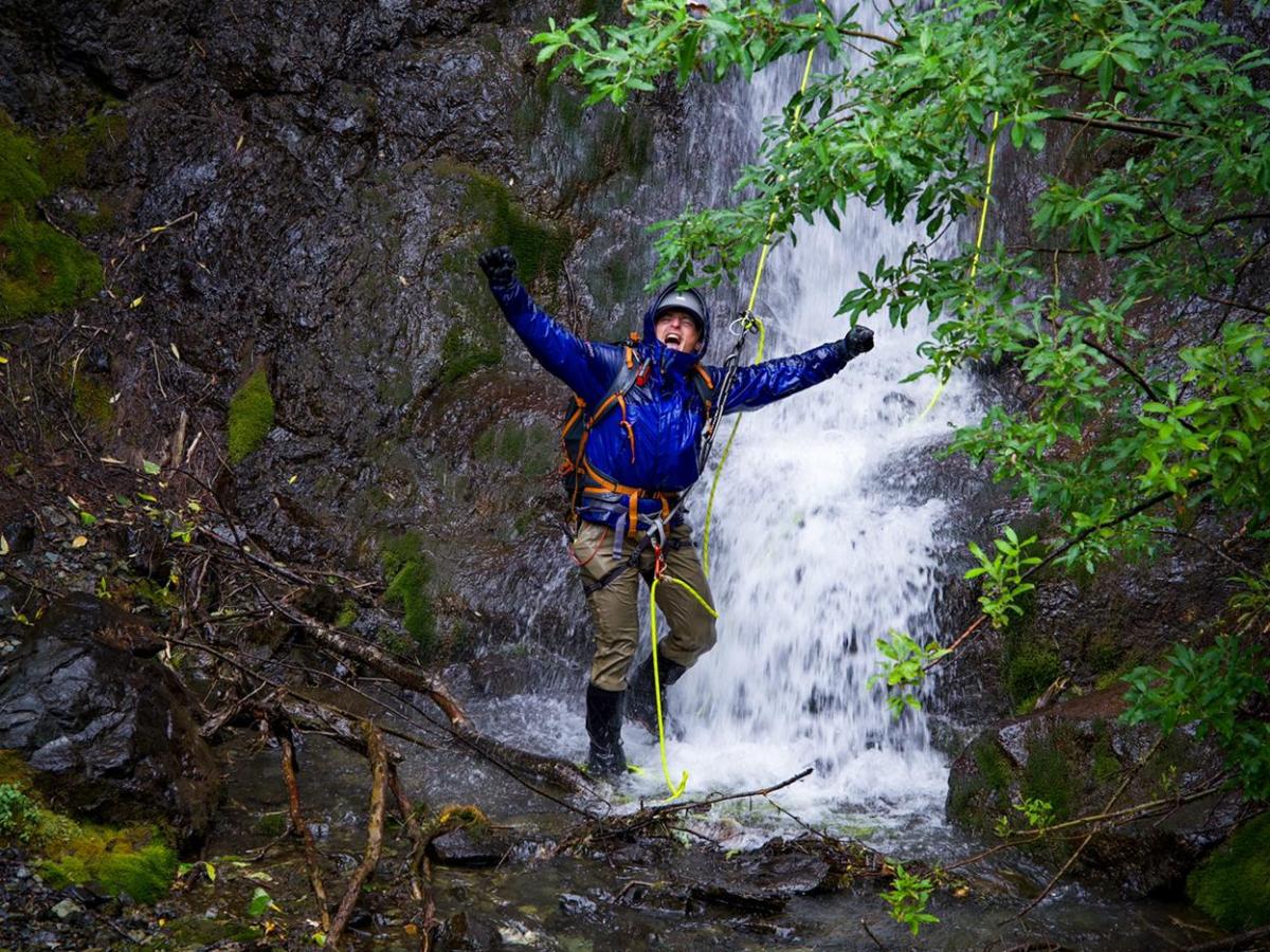 a man riding on the back of a waterfall