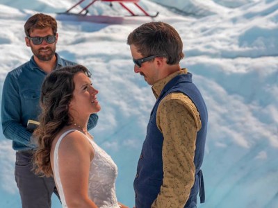 a man and a woman standing in the snow